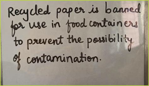 Why is recycled paper banned for use in food containers?